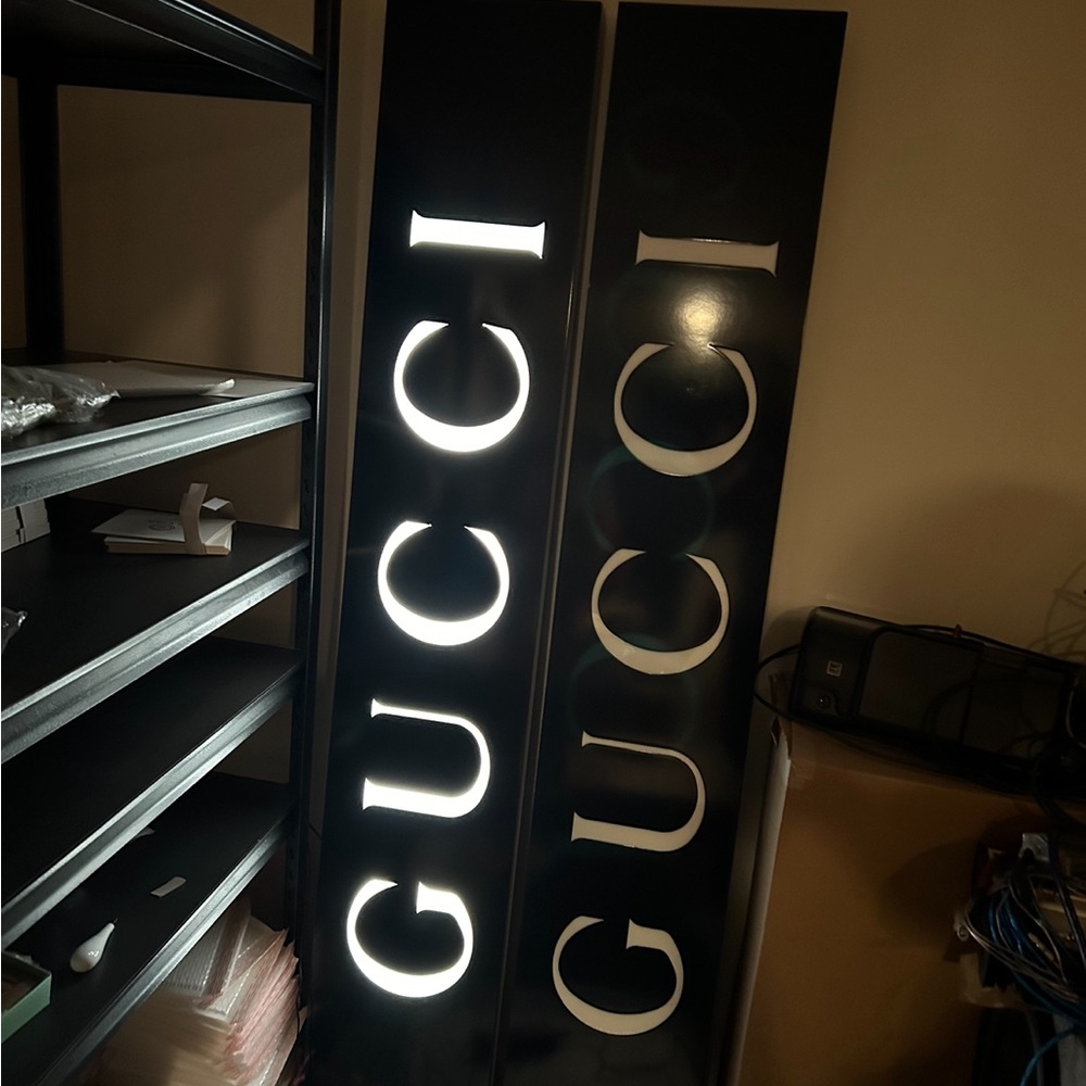This is an official Gucci light up sign that was removed from a Gucci store.